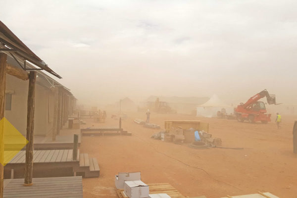 Tent resort under construction in a sandstorm