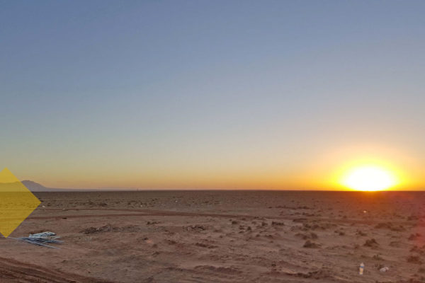 View of desert landscape at sunset